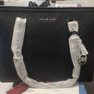 Brand new Michael Kors handbag with tags.